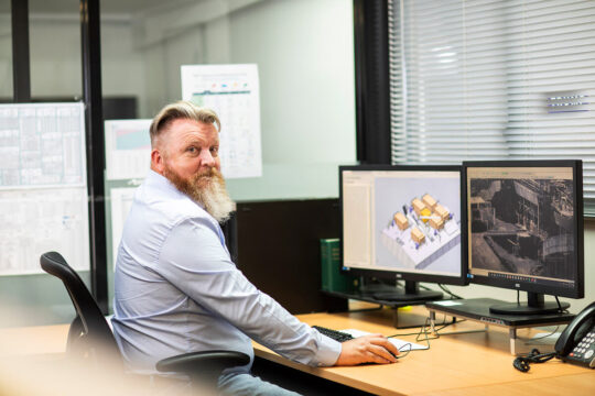 Field Engineers Employee working in a computer with prototype at Field Engineers