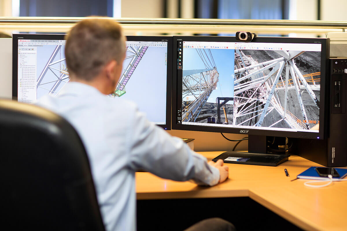 Working Employee with a great computer set up at Field Engineers